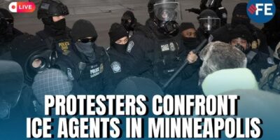 Armed, masked ICE agents confront sign carrying protesters in the street