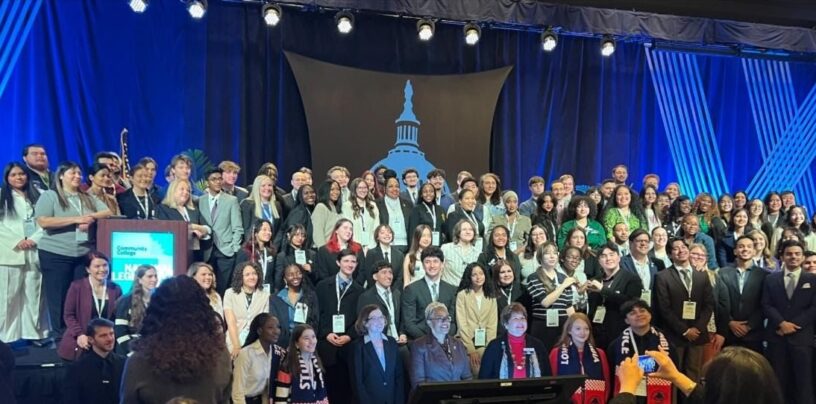 Two-hundred community college students on stage at a conference